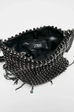 BOLSO DE HOMBRO APLIQUES METÁLICOS