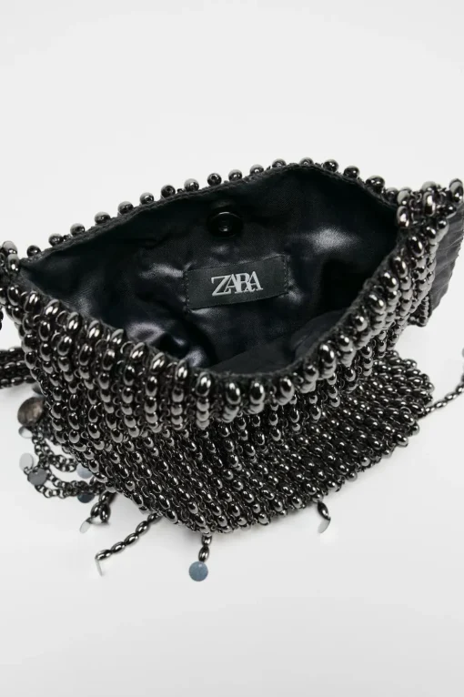 BOLSO DE HOMBRO APLIQUES METÁLICOS