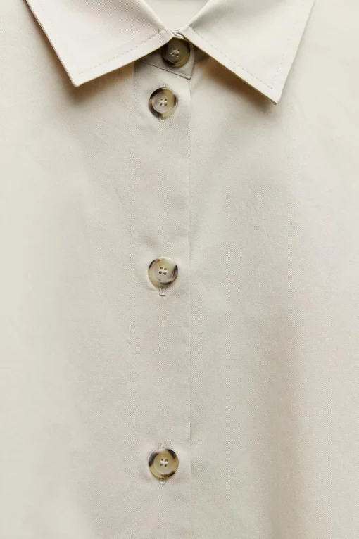 CAMISA OVERSIZE BOTONES LATERALES