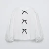 CAMISETA APLIQUE LAZOS