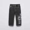 PANTALÓN DENIM TEXTO